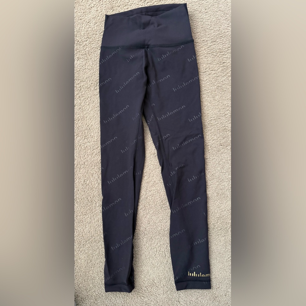 Lululemon Wunder Train Black embossed logo with Gold Logo